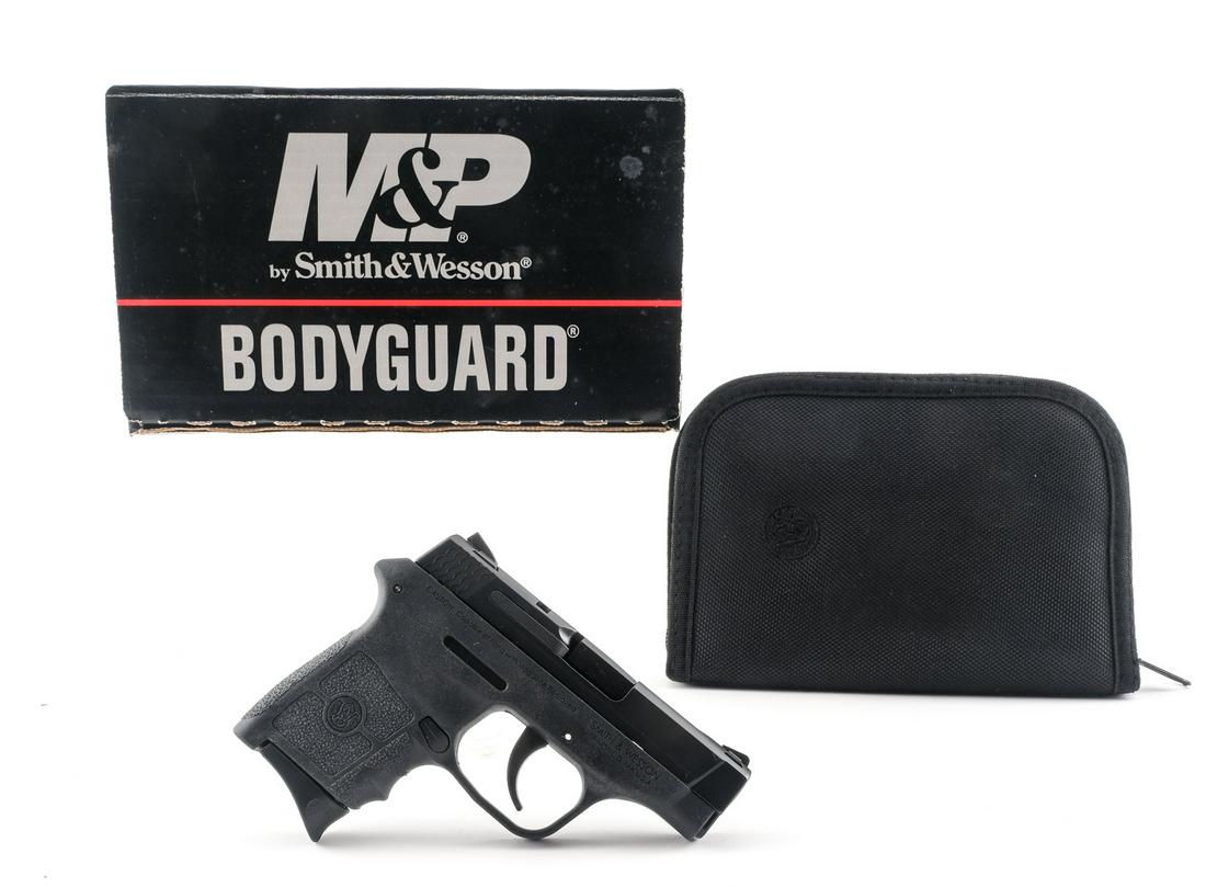 S&W Bodyguard .380ACP Semi Pistol: Description Smith & Wesson Model Bodyguard 380 in .380 ACP with two, six round removable magazines with a 2 3/4" barrel. Textured grip on a black composite frame. Black finished serrated metal slide.