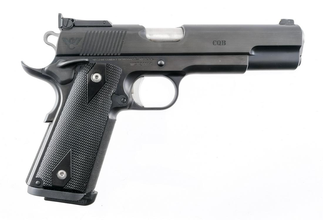 Wilson Combat CQB .45ACP Semi Auto Pistol: Description Wilson Combat Model CQB in .45 ACP with one, eight round removable magazine and a 5" barrel. Black metal checkered grip plates. Blued frame, serrated skeletonized hammer and serrated slide