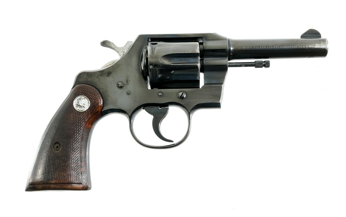 Colt Official Police 38 Spl DA Revolver: Description Colt Official Police in .38 Special with a six round cylinder capacity and a 4" barrel. Colt checkered wood grip plates. Blued frame, serrated trigger, serrated hammer, cylinder and barrel