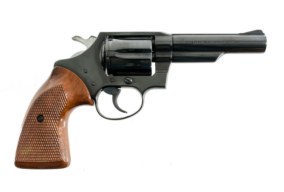 Colt Police Positive 38 Spl DA Revolver: Description Colt Police Positive in .38 Special with a six round cylinder capacity and a 4" barrel. Checkered wood grip plates. Blued frame, smooth trigger, serrated hammer, cylinder and barrel. Left 