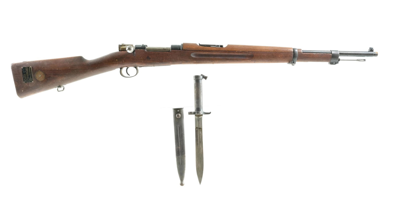 Mauser M 1938 6.5x55mm Bolt Action Rifle: Description Mauser Model 1938 in 6.5x55mm with a five round internal magazine capacity and a 23.5" barrel. Made in Germany and imported by C.A.I. Metal butt plate. Smooth wood stock and front forend. 