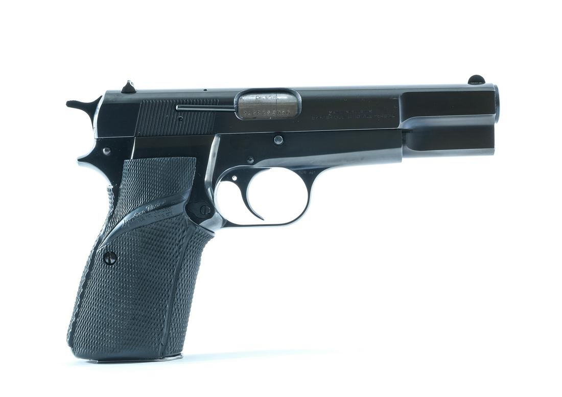 Browning Hi Power 9mm Semi Auto Pistol: Description Browning Hi Power in 9 mm with one, fifteen round removable magazine with a 5" barrel. Made by Fabrique Nationale Herstal in Belgium. Black rubber checkered Pachmeyer grip plates. Blued fr