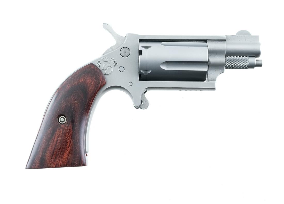 Charter Arms Dixie Derringer .22 Mag: Description Charter Arms Dixie Derringer in .22 WMR (.22 Mag) with a five round cylinder capacity with a 1 1/4" barrel. Laminated smooth wood grip plates. Matte silver finished metal frame, cylinder a