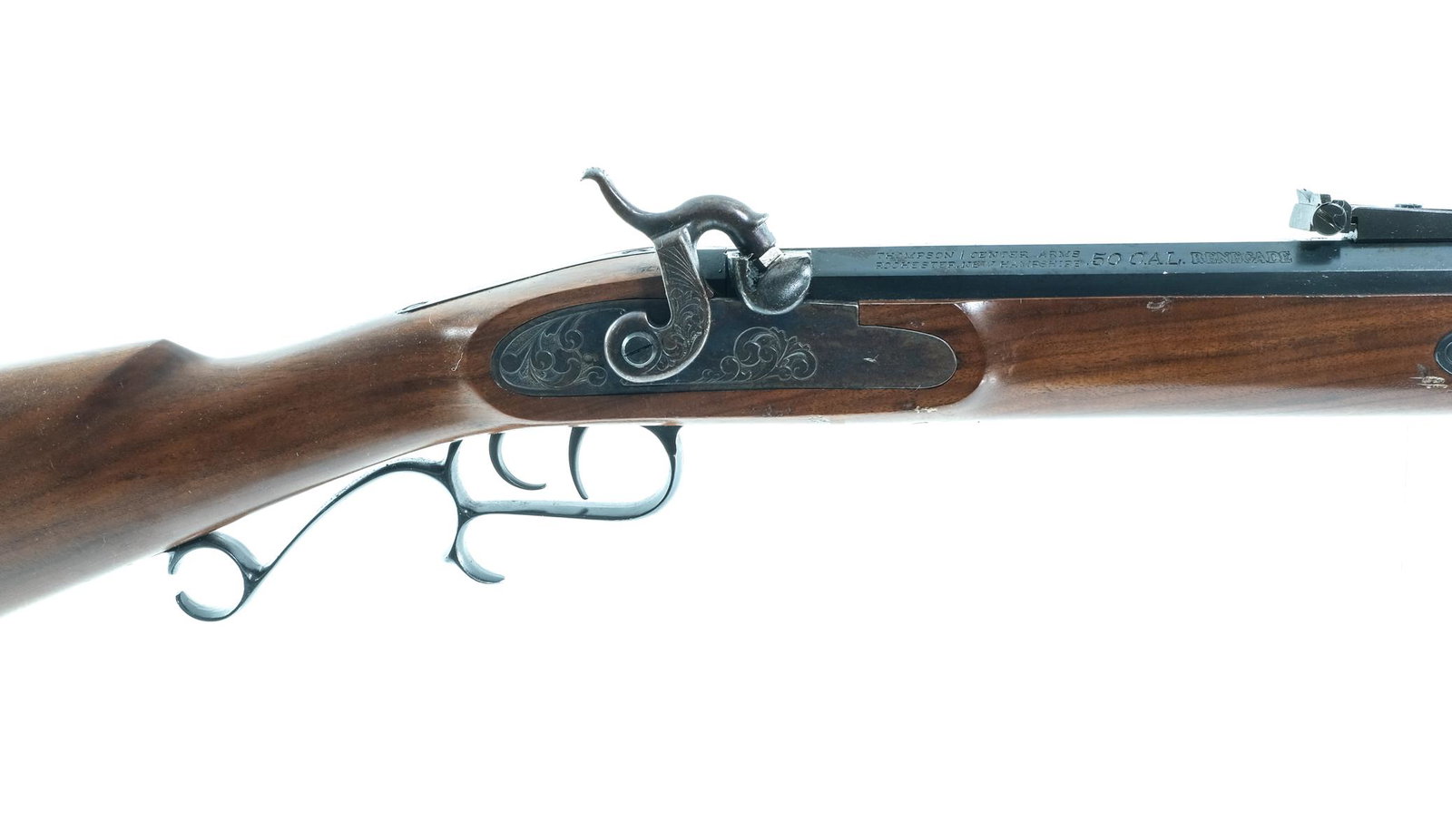 Thompson Center Renegade .50 Cal BP Rifle: Description Thompson Center Renegade .50 caliber percussion cap and ball with a single round capacity and a 26" octagonal barrel. Metal butt plate. Smooth wood stock and front forend. Blued guard, smo