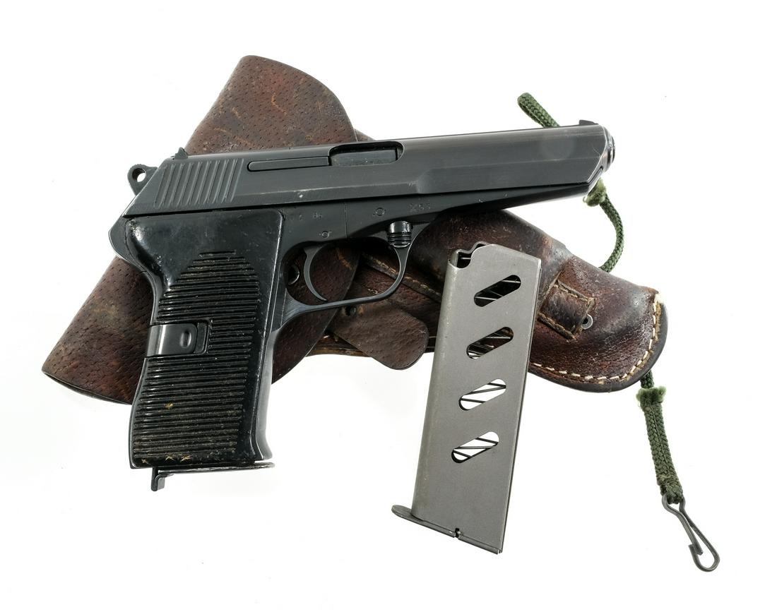CZ VZ-52 7.62x25 Semi Auto Pistol: Description CZ VZ-52 in 7.62x25 Tokarev with two, eight round removable magazines and a 4.5" barrel. Made in the Czech republic and import marked by INTRAC KNOX TN. Serrated composite grip plates. Blu