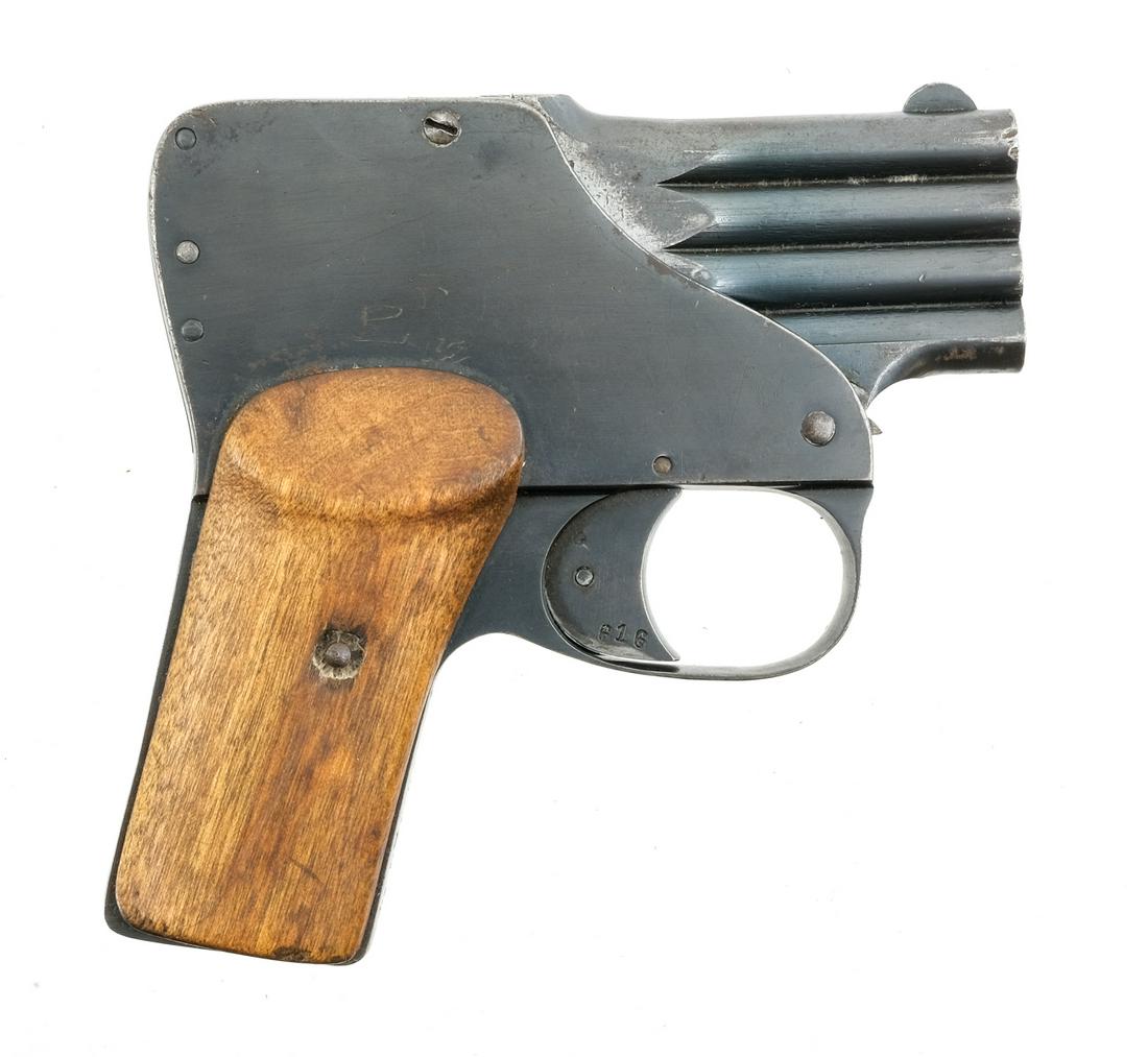 Belgian Tomma Reform .25ACP Pistol: Description Belgian Tomma Reform in .25 ACP with a four round capacity in four 2.5" barrels. Smooth wood grip plates. Blued frame, smooth solid trigger and barrels. Left side of frame serrated safety 