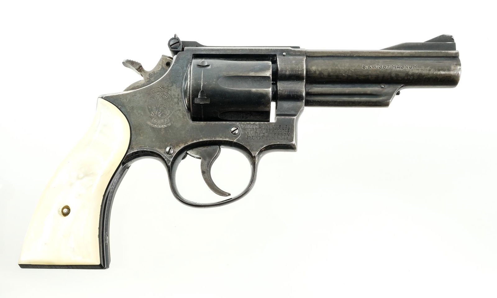 Smith & Wesson 19-3 .357 Mag Revolver: Description S&W Model 19-3 in .357 Magnum with a six round cylinder capacity and a 4" barrel. Faux pearl composite grip plates. Blued frame, cylinder and barrel. Case colored serrated Target trigger a