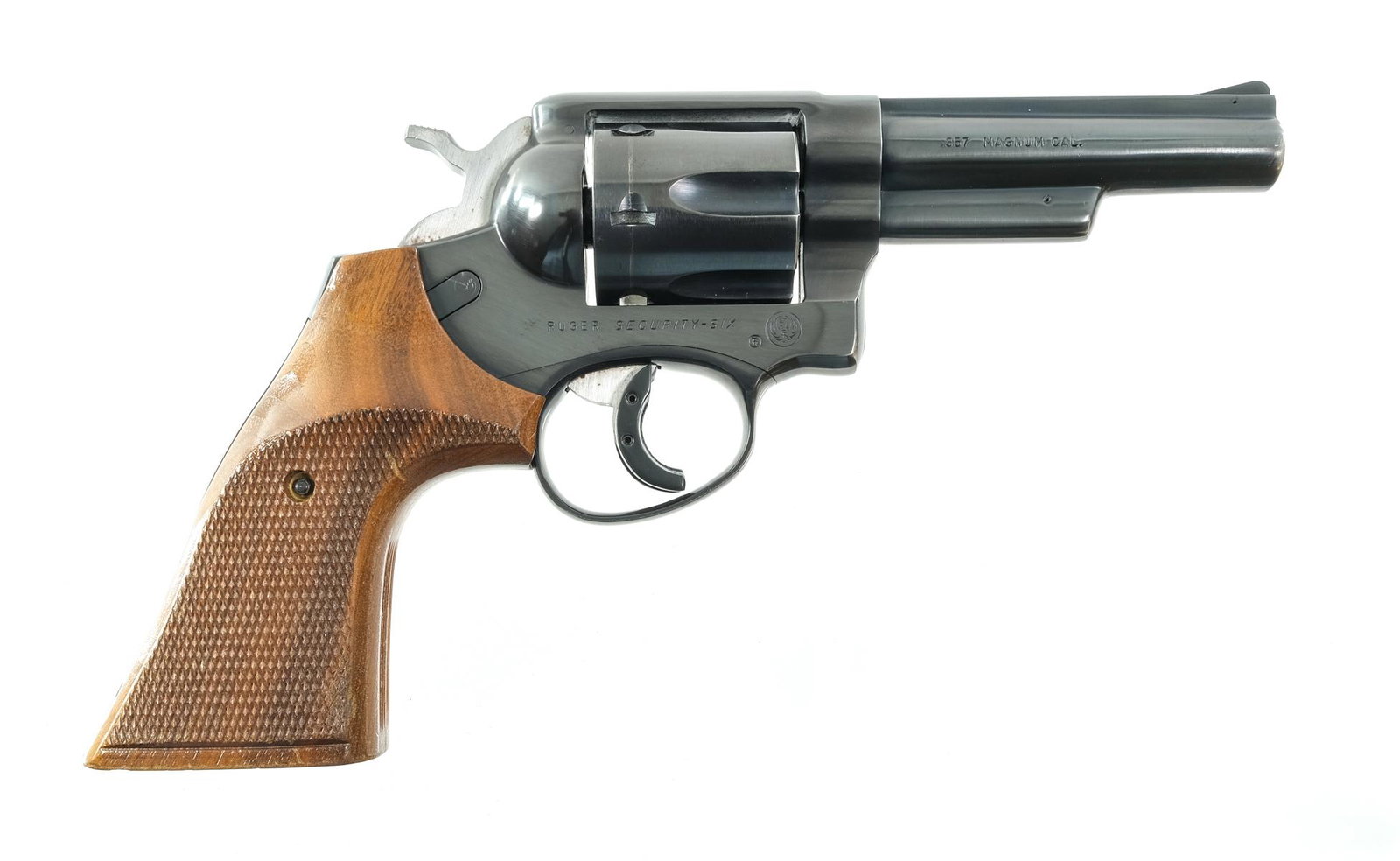 Ruger Security Six .357 Mag Revolver: Description Ruger Security Six in .357 Magnum with a six round cylinder capacity and a 4" barrel. Checkered wood grip plates. Blued frame, serrated trigger, checkered hammer, cylinder and barrel. Left