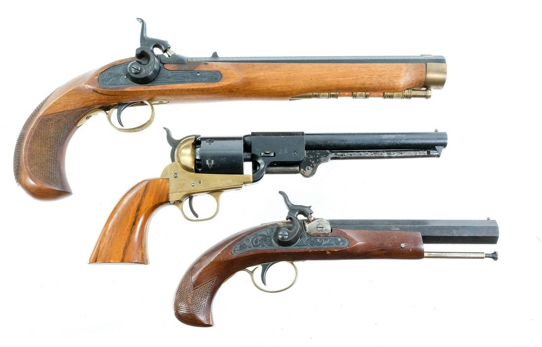 Estate lot: 3 Black Powder Pistols: Description This lot is for three Black Powder Pistols. The first is a Navy Arms revolver in .36 caliber cap and ball. Smooth wood grip plates. Brass frame and trigger guard. Blued cylinder and barrel