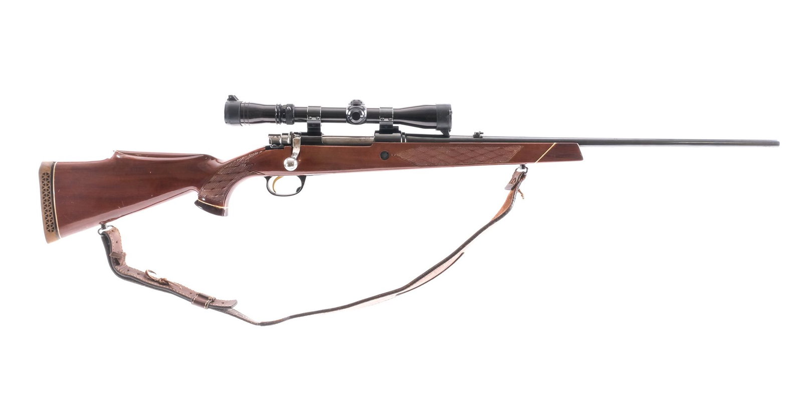 Parker Hale .30-06 Bolt Action Rifle: Description Parker Hale rifle in .30-06 with a five round capacity and a 24" barrel. Made in England. PH rubber butt pad. Monte Carlo Style checkered stock and front foregrip. Blued trigger guard, mag