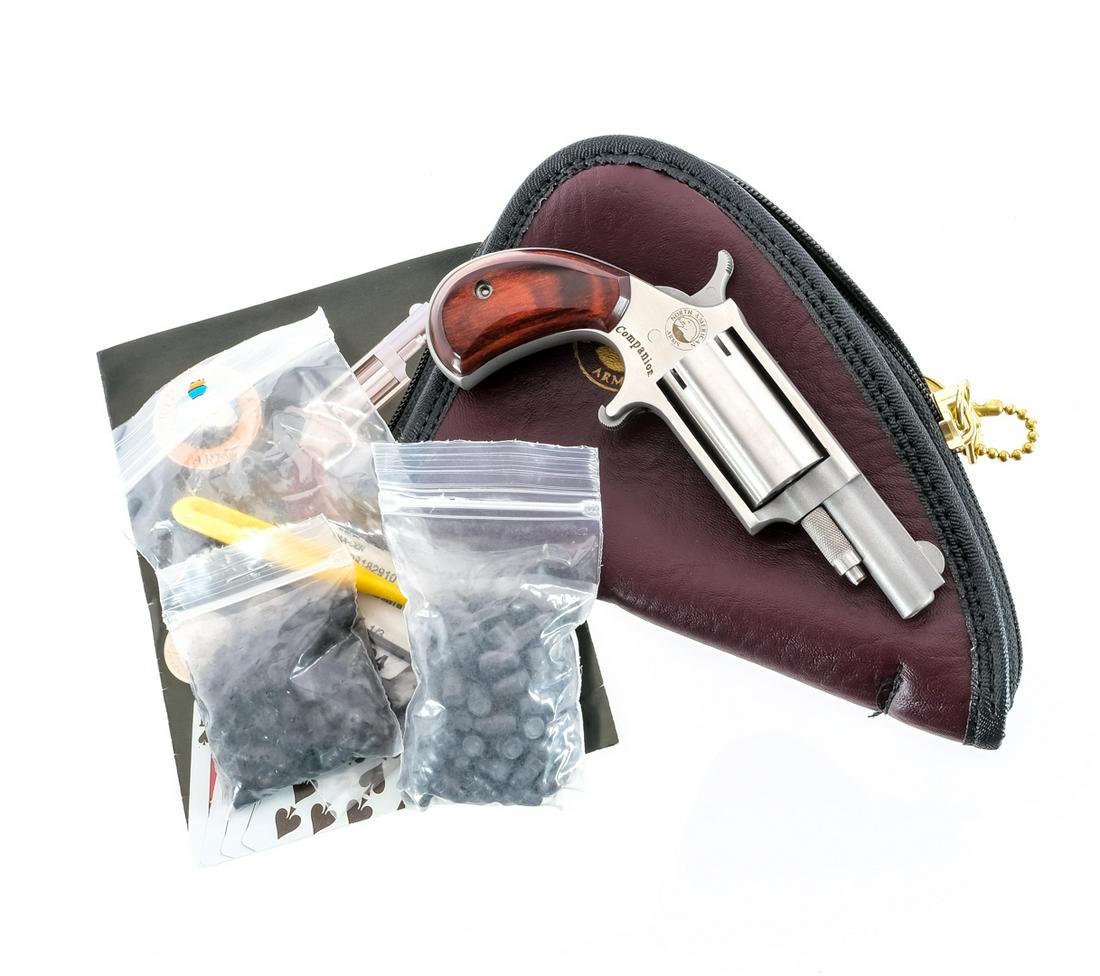 NAA Companion .22 Cal Black Powder Revolver: Description NAA Companion in .22 caliber black powder cap and ball with a five round cylinder capacity and a 1.5" barrel. Smooth wood grip plates. Polished stainless steel frame, cylinder and barrel. 