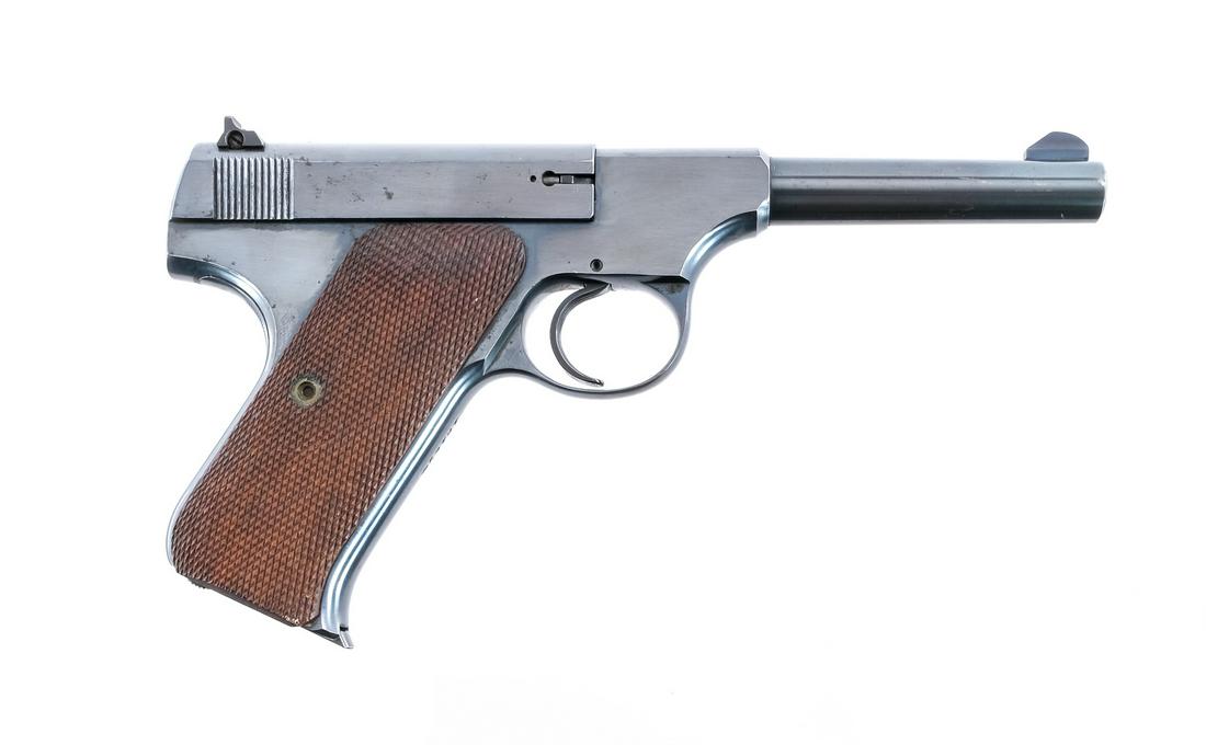 Colt Woodsman .22 LR Semi Auto Pistol: Description Colt The Woodsman in .22 Long Rifle with one Colt ten round removable magazine and a 4.5" barrel. Checkered wood grip plates. Blued frame, serrated trigger, serrated slide and barrel. Magw