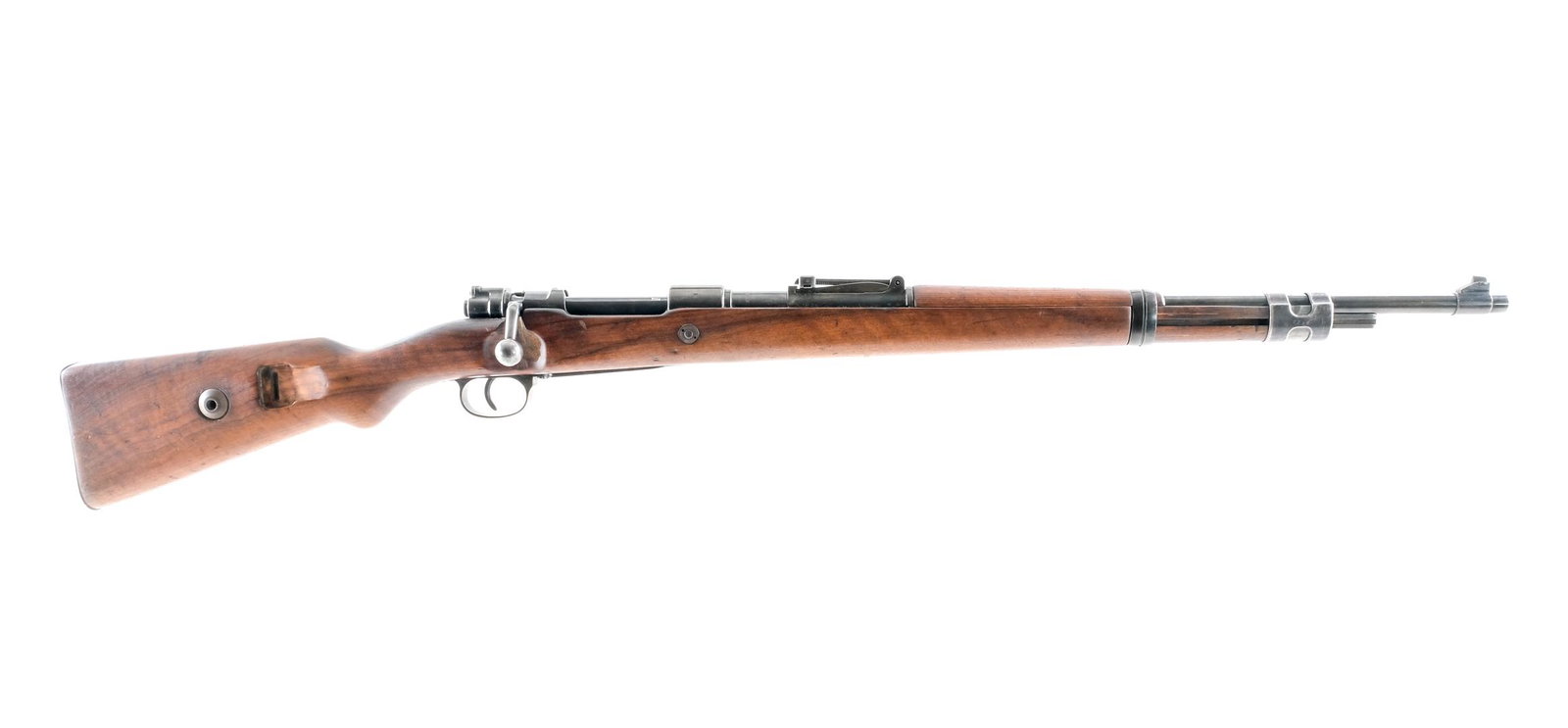 JP Sauer & Sohn K98 8mm Bolt Action Rifle: Description J.P. Sauer & Sohn K98 in 8mm with a five round capacity and a 23" barrel. Metal butt plate. Smooth wood stock and front foregrip. Blued trigger guard, untextured trigger, receiver , bolt a
