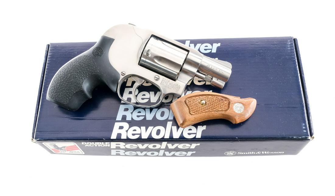 S&W 649-2 .38 Spl Revolver: Description Smith & Wesson Model 649-2 in .38 Special with a five round capacity and a 2" barrel. Hogue textured rubber grips. Polished stainless steel frame, cylinder and barrel. Case colored untextu