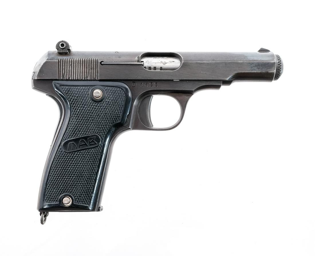 MAB Model D .32 ACP Semi Auto Pistol: Description MAD Model D in .32 ACP with one, nine round removable magazine and a 4" barrel. Made in France. Checkered composite grip plated with thumb rest. Blued frame, solid trigger and serrated sli