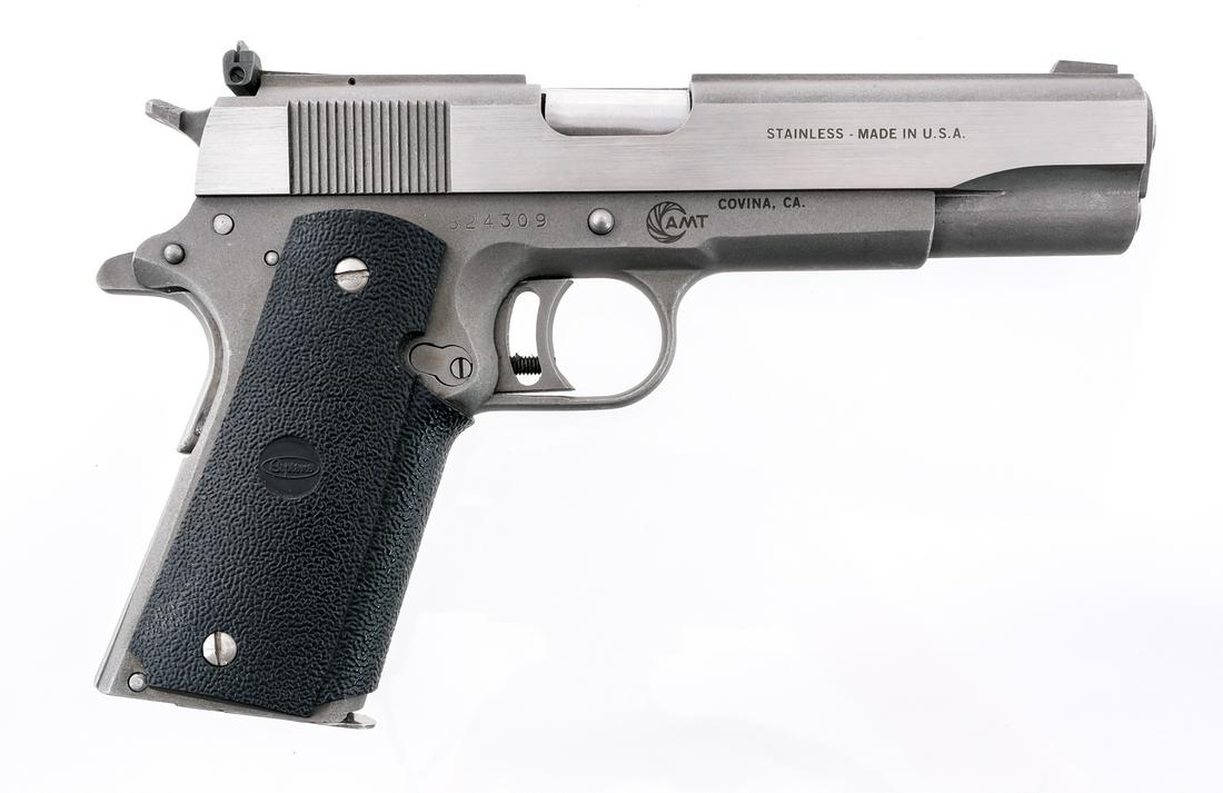 AMT Hardballer .45 ACP Semi Auto Pistol: Description AMT Hardballer chambered in .45 ACP with one, seven round removable magazine and a 5" barrel. Grey/silver finished frame with Supreme rubber wrap around grips. Grey/ stainless serrated sli