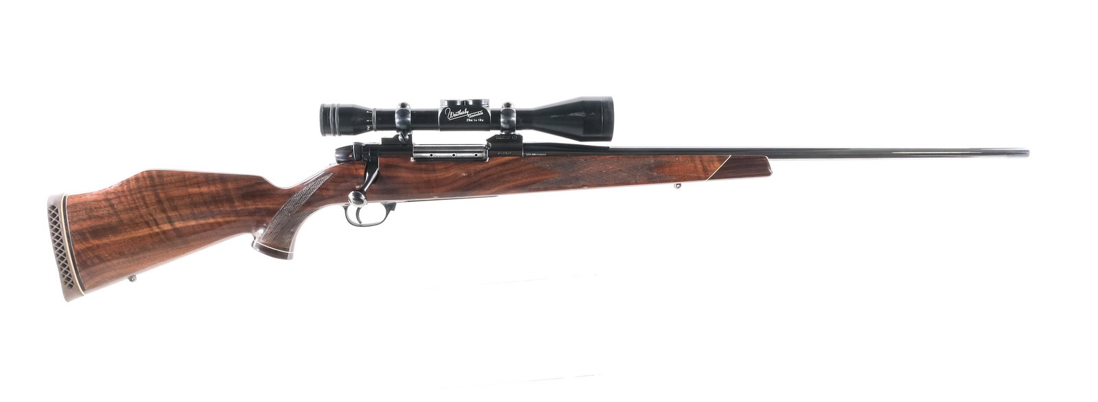 Weatherby Mark V .300 Win Mag Bolt Action Rifle: Description W. German Weatherby Mark V in .300 Win Magnum with a three round capacity and a 24" tapered barrel. Textured rubber butt pad. Checkered Monte Carlo style wood stock and front forend. Blued