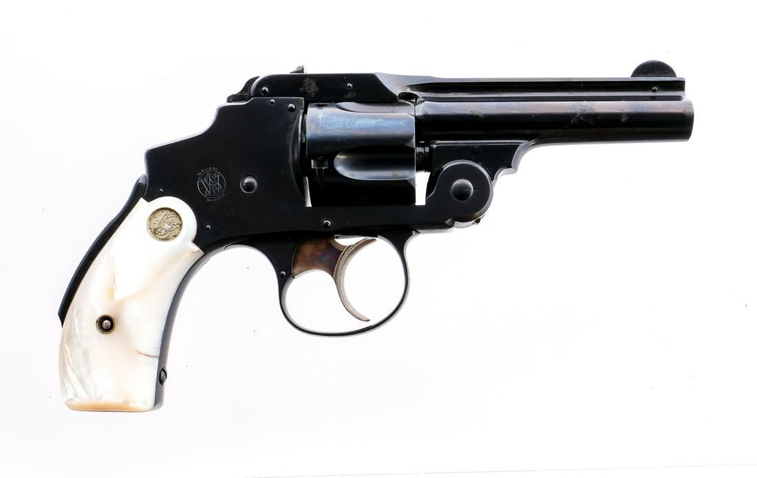 S&W 38 Safety Hammerless .38 S&W Revolver: Description Smith & Wesson 38 Safety Hammerless 3rd Model in .38 Smith & Wesson with a five round capacity and a 3.25" barrel. Rear Mother Of Pearl grip plates. Case colored untextured trigger. Blued