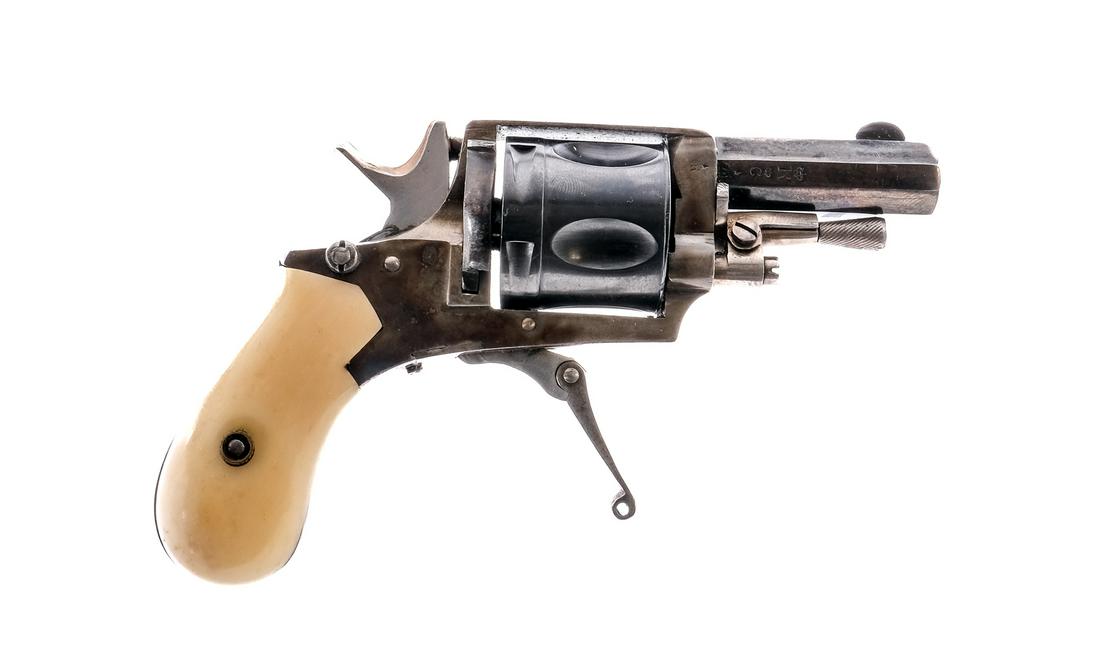 Belgian Drop Trigger .32 RF Revolver: Description Belgian made drop trigger revolver in .32 Rimfire with a five round capacity and a 1.75" octagon barrel. Smooth composite grip plates. Case colored folding trigger, frame and checkered ham