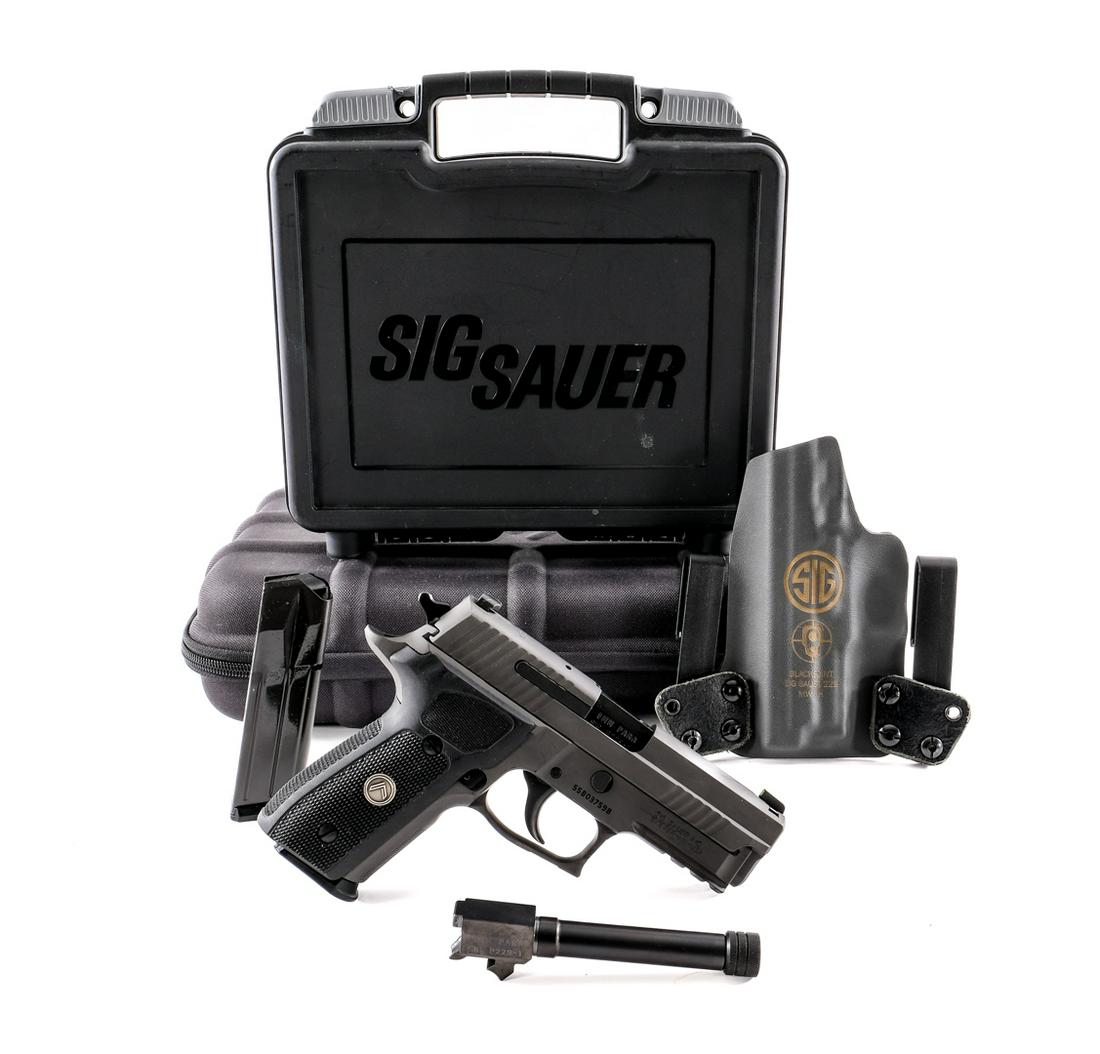 Sig Sauer P229 Legion 9mm Semi Auto Pistol: Description Sig Sauer P229 Legion in 9mm with two, fifteen round removable magazines and a 3.75" barrel. Checkered composite grip plate. Matte finished frame and serrated slide. Blued untextured trigg