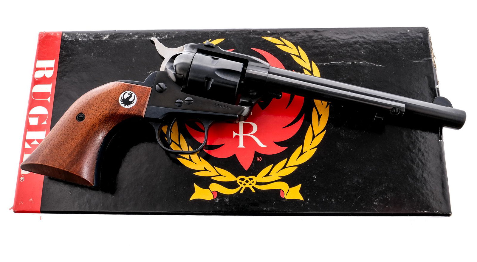 Early Ruger Single Six .22 Magnum Revolver: Description Ruger Single Six chambered in .22 magnum with a six-shot cylinder and a 6.5" barrel. Blued barrel, frame, cylinder, trigger guard, and trigger. Stainless serrated hammer. Smooth wood Ruger