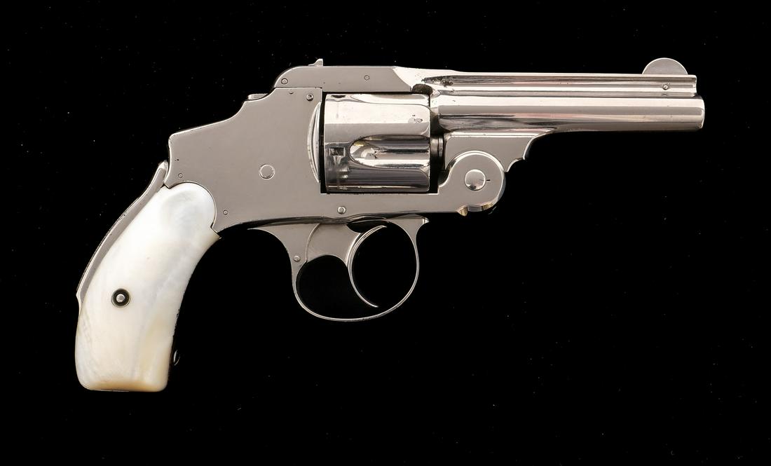 S&W 38 Safety Hammerless .38 S&W Revolver: Description Smith & Wesson 38 Safety Hammerless in .38 Smith & Wesson with a five round capacity and a 3.25" barrel. Rear mother of pearl grip plates. Nickel plated frame, trigger guard, trigger, cyli