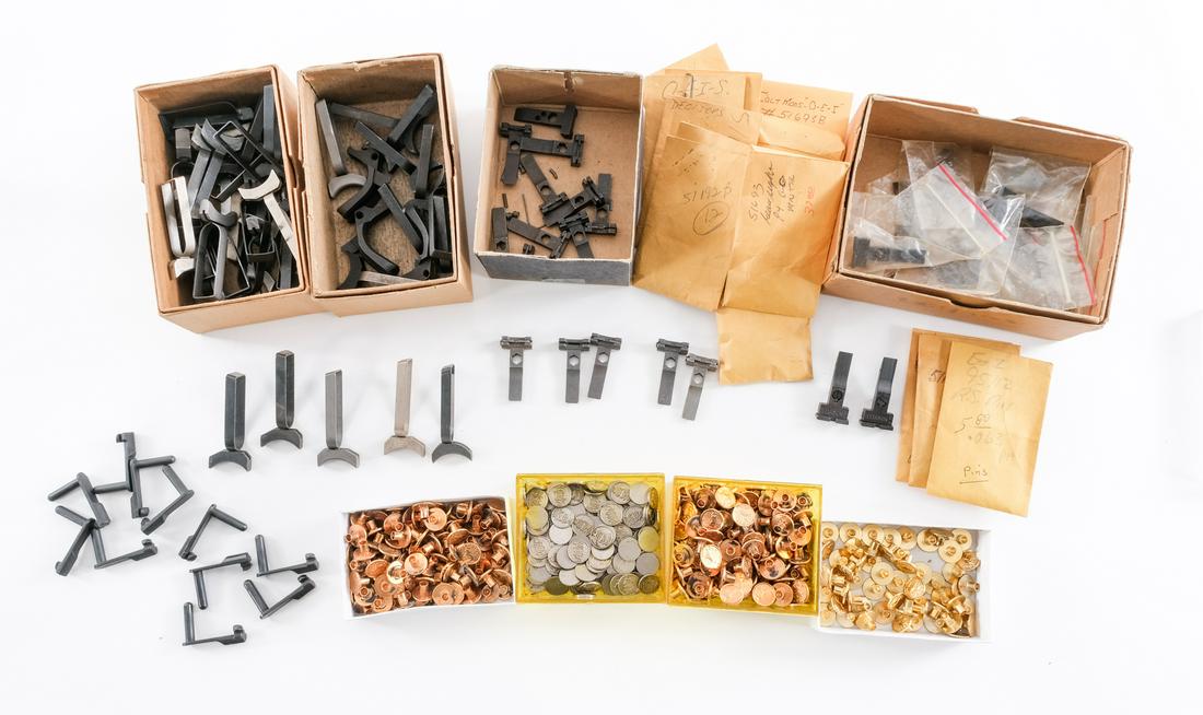 Assorted Colt 1911 Parts: Description This lot is for various 1911 parts, first is 40+ 1911 triggers of varying styles and finishes. Next is 20+ rear sights of different adjustability and style. Ten slide stops and three backs