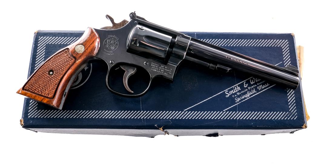 S&W 48-4 .22 Mag Revolver: Description Smith & Wesson 48-4 K-22 Masterpiece chambered in .22 Magnum Rimfire with a six-shot cylinder and a 6" serrated ribbed barrel. Square butt K target frame revolver with a blued barrel, fram