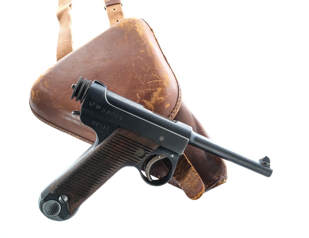 Japanese Nambu Type 14 8x22mm Semi Pistol: Description Japanese Nambu Type 14 in 8x22mm which is 8mm Nambu with one, eight round removable magazine and a 4.5" barrel. Nagoya/Chuo Kogyo Arsenal made in November of 1937. Serrated wood grip plate