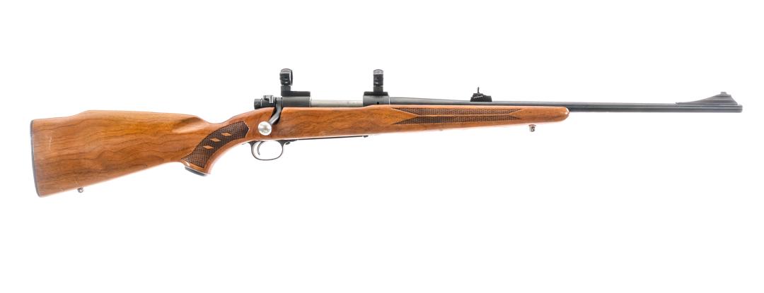 Winchester 70 .243 Win Bolt Action Rifle: Description Winchester 70 chambered in .243 Winchester with a internal magazine and a 22" barrel. Blued barrel, receiver, and magazine floor plate. Jeweled bolt with bolt safety selector. Wood stock w