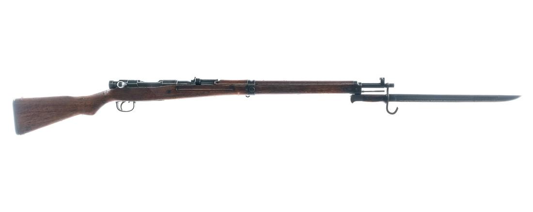 Arisaka Type 99 7.7 Bolt Action Rifle: Description Arisaka Type 99 in 7.7x58mm with a five round capacity and a 25" barrel. Series 33, Toyo Kogyo marked receiver. Metal butt plate. Smooth wood stock and front foregrip. Blued trigger guard,
