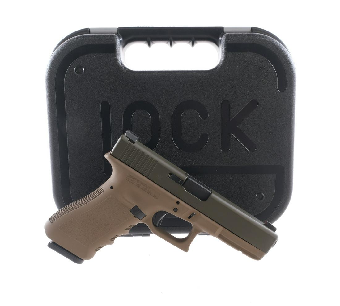 Glock 17 Gen 2 9mm Semi Auto Pistol: Description UPDATE: This is a Generation 3.Glock Model 17 Generation 2 in 9mm. Two-Tone finish. Textured grip on tan composite frame. Black composite trigger. Serrated metal olive drab colored slide. 