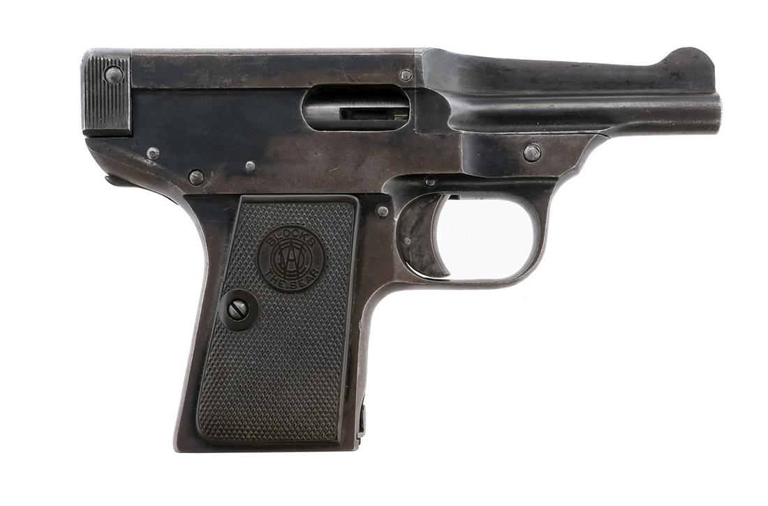 Warner Infallible .32 Semi Auto Pistol: Description Warner Arms Corporation "The Infallible" in .32 caliber missing its magazine with a 3.25" barrel. Checkered composite grip plates. Blued frame, serrated charging handle and barrel. Case co