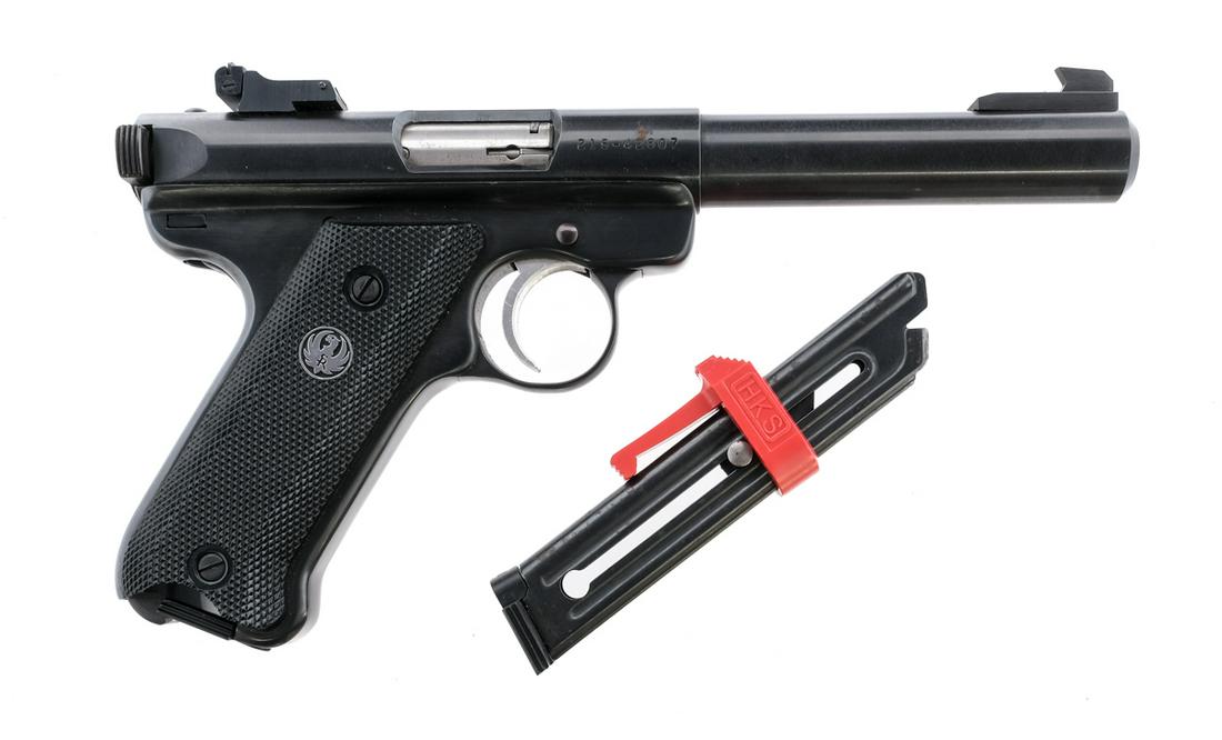 Ruger Mark II Target .22 LR Semi Auto Pistol: Description Ruger Mark II Target in .22 Long Rifle with two, ten round removable magazines and a 5.5" heavy bull barrel. Checkered composite grip plates. Blued frame, serrated charging handle and barr