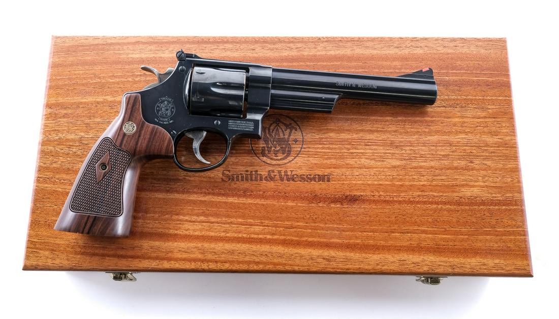 Smith & Wesson 29-10 .44 Magnum Revolver: Description Smith & Wesson 29-10 chambered in .44 Magnum with a six-shot cylinder and a 6.5" barrel. Blued barrel, frame, and cylinder. Case colored textured trigger and hammer. Slim checkered wood gr