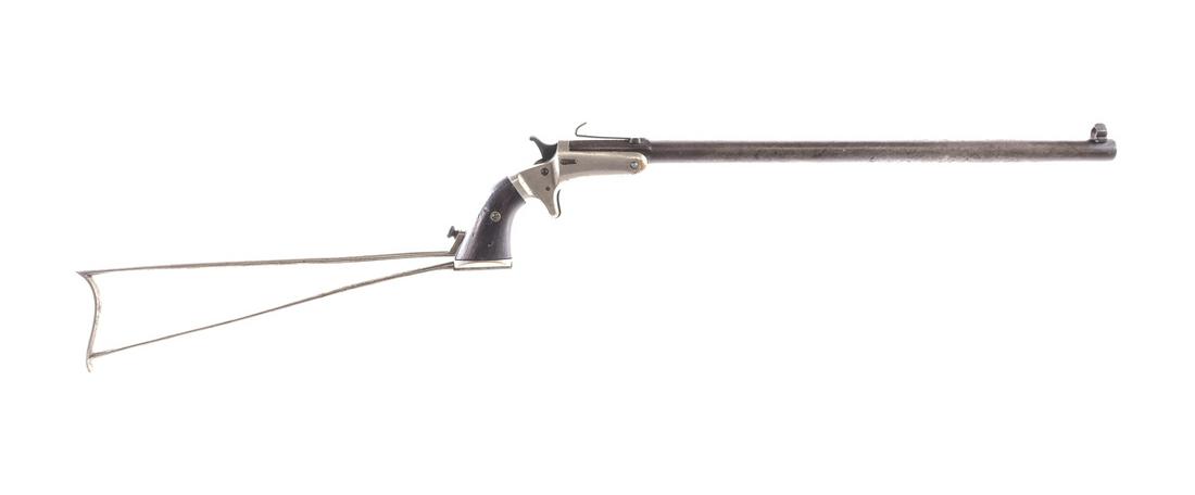 J Stevens Bicycle Rifle .32 RF Single Shot Rifle: Description J. Stevens Bicycle Rifle in .32 Rimfire with a single round capacity and a 15" barrel. Wire shoulder stock. Smooth wood grip plates. Nickel finished frame. Blued solid trigger, checkered h