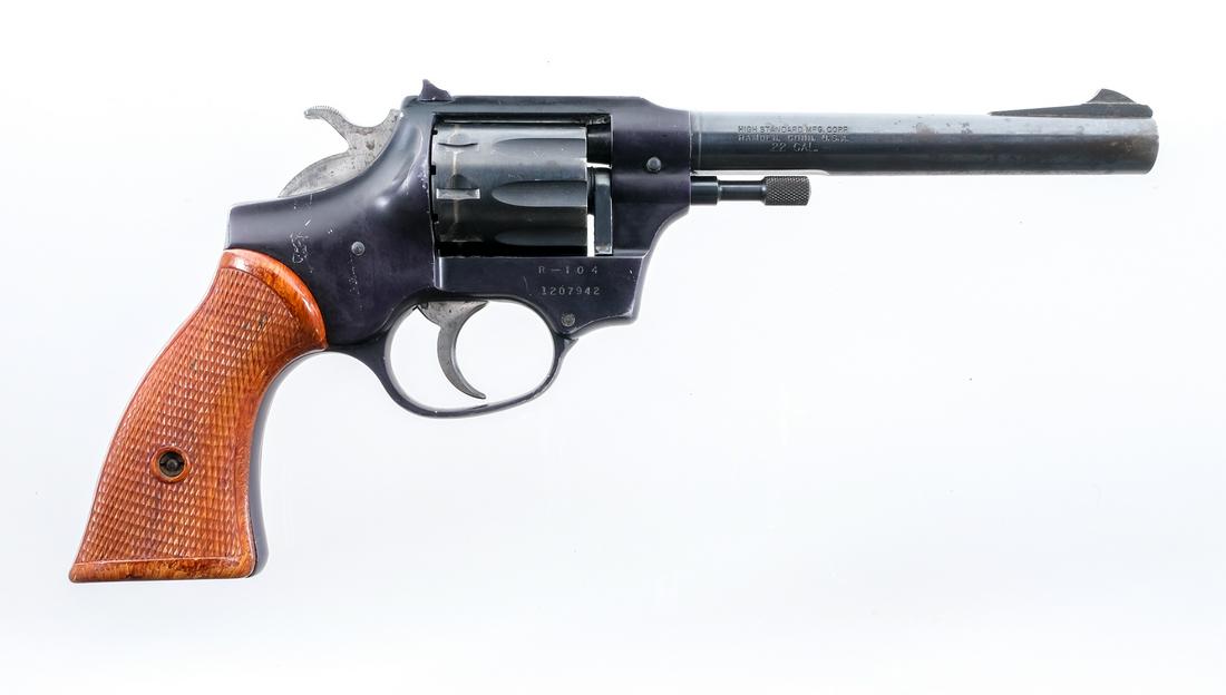 Hi Standard R-104 .22 Revolver: Description Hi Standard Model R-104 in .22 caliber with a nine round capacity and a 6" barrel. Checkered composite grip plates. Black finished alloy frame. Blued serrated trigger, serrated hammer, cyl