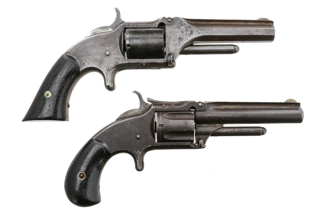 S&W Model 1 .32 2Pcs Lot Revolver: Description Smith & Wesson revolver lot with two revolvers. S&W 1 1/2 New Model 2nd Issue in .32 Rimfire Long with a five round capacity and a 3.5" barrel. Smooth wood matching serial number grip plat