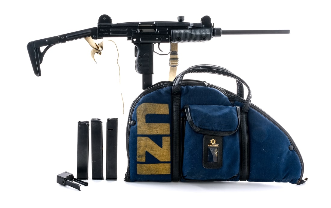 Pre Ban IMI UZI Model A 9mm Semi Auto Rifle: Description Pre Ban IMI UZI Model A chambered in 9mm with four, fifteen round removable magazines and a 16" twist off barrel. Made in Israel by IMI and imported by Action Arms LTD. Ribbed polymer hand