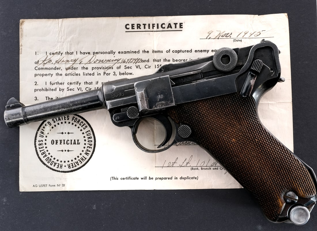German WWII Mauser Luger P08 9mm 1937 Pistol: Description Mauser Luger P08 in 9mm with one, eight round removable magazine and a 4" barrel. Checkered wood grip plates with matching serial number on one side. Blued frame, trigger, checkered chargi
