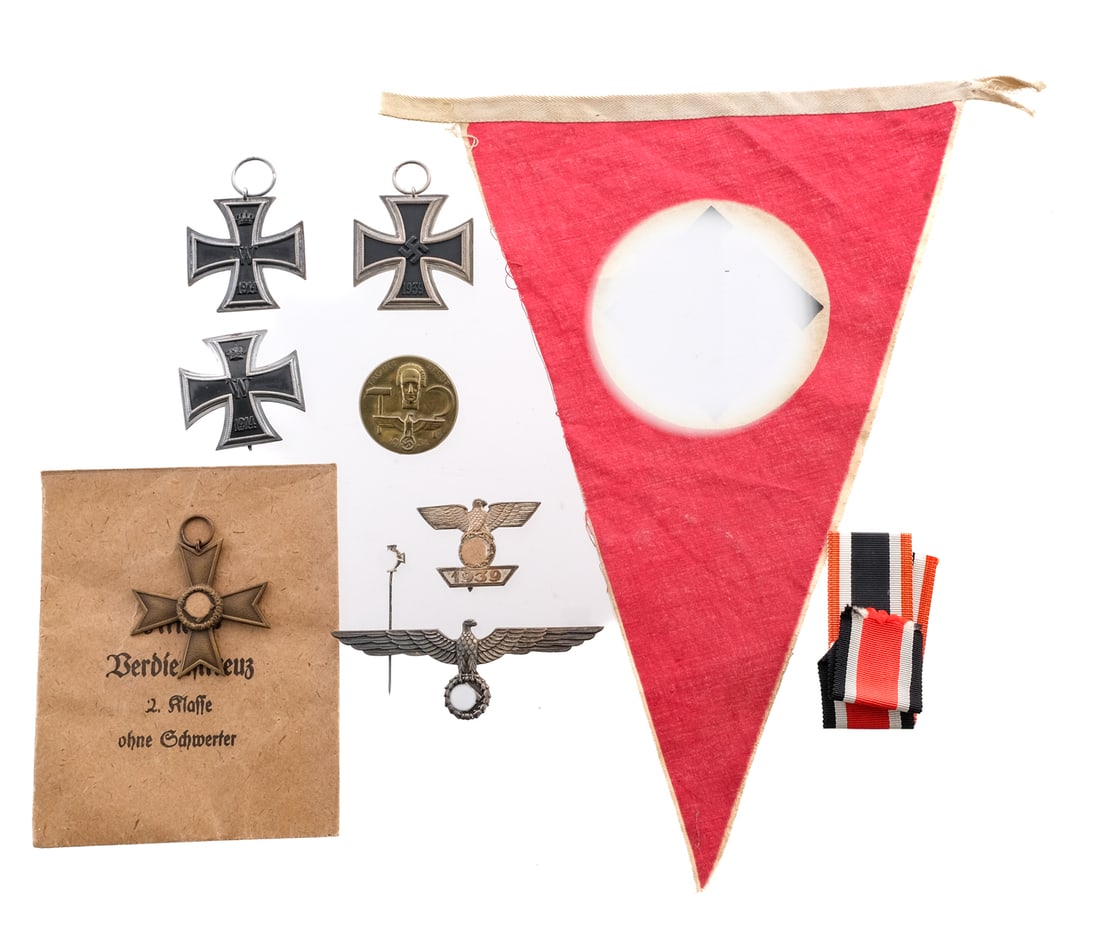 Third Reich German Lot: Description Estate lot of eleven ephemera items from Germany. Includes a 1939 Merritt Cross without crossed swords and with a paper envelope it came in. Maker marked on the back of the envelope Carl P