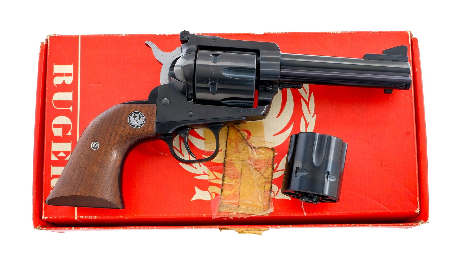 Ruger NM Blackhawk .45 Colt/ACP Revolver: Description Ruger New Model Blackhawk chambered in .45 caliber with two six-shot cylinders, one in .45 ACP and the other in .45 Colt. Blued 4 5/8" barrel, frame, fluted cylinder, and trigger. Smooth w