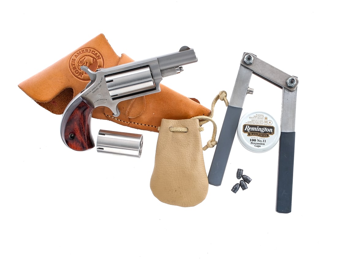 NAA Companion .22 Percussion Revolver: Description North American Arms Companion chambered in .22 caliber balls and #11 percussion caps with two five-shot cylinders with five nipples in each and a 1.63" Stainless steel finish with rosewood