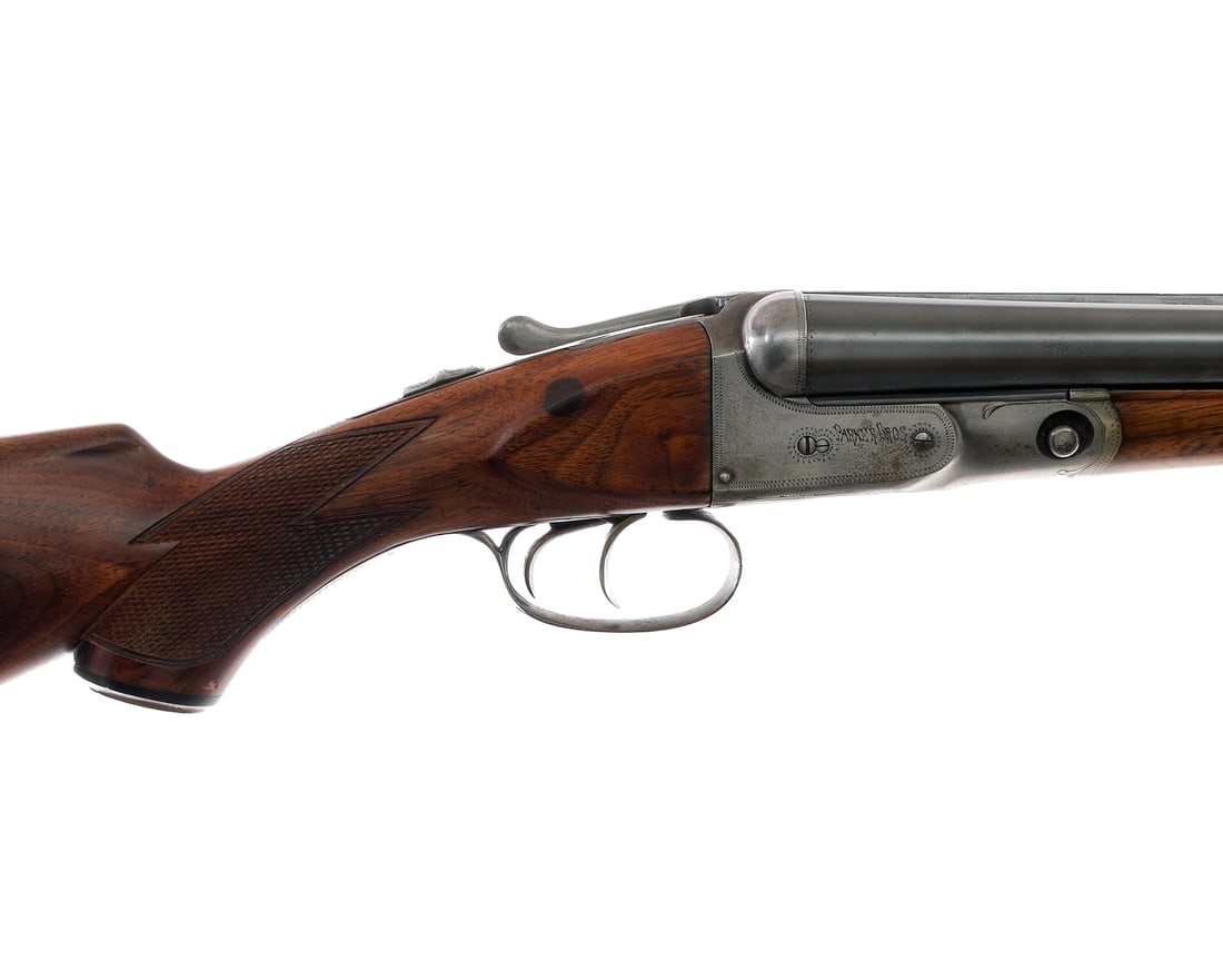 Parker Bros V Grade 12Ga SxS Shotgun: Description Parker Bros V Grade 12 gauge shotgun with a two round capacity and a 26" side by side top ribbed barrel. Made in Meriden Connecticut. Left barrel has a FULL and Right a MOD fixed choke. Ch
