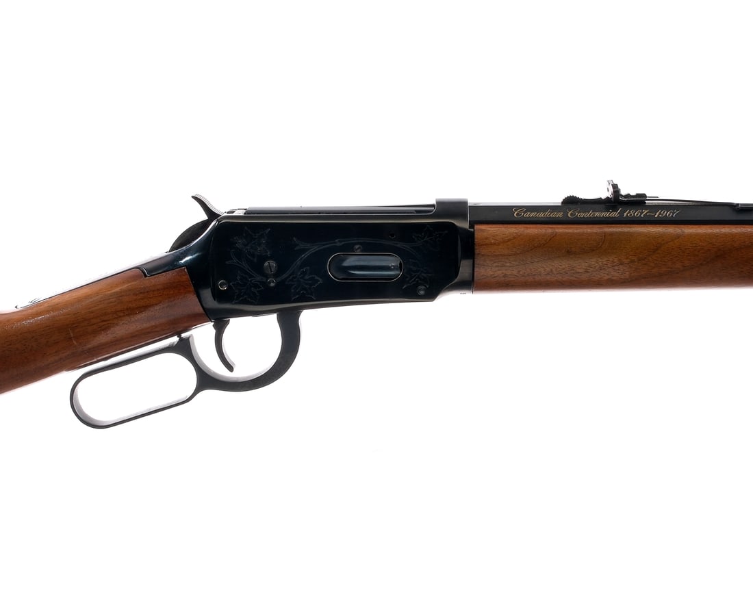 Winchester 94 Canadian .30-30 Lever Action Rifle: Description Winchester 94 Canadian Centennial chambered in .30-30 Win with a full length magazine tube and a 26" octagonal barrel. Manufactured in 1967 with serial number 53406. The right side of the