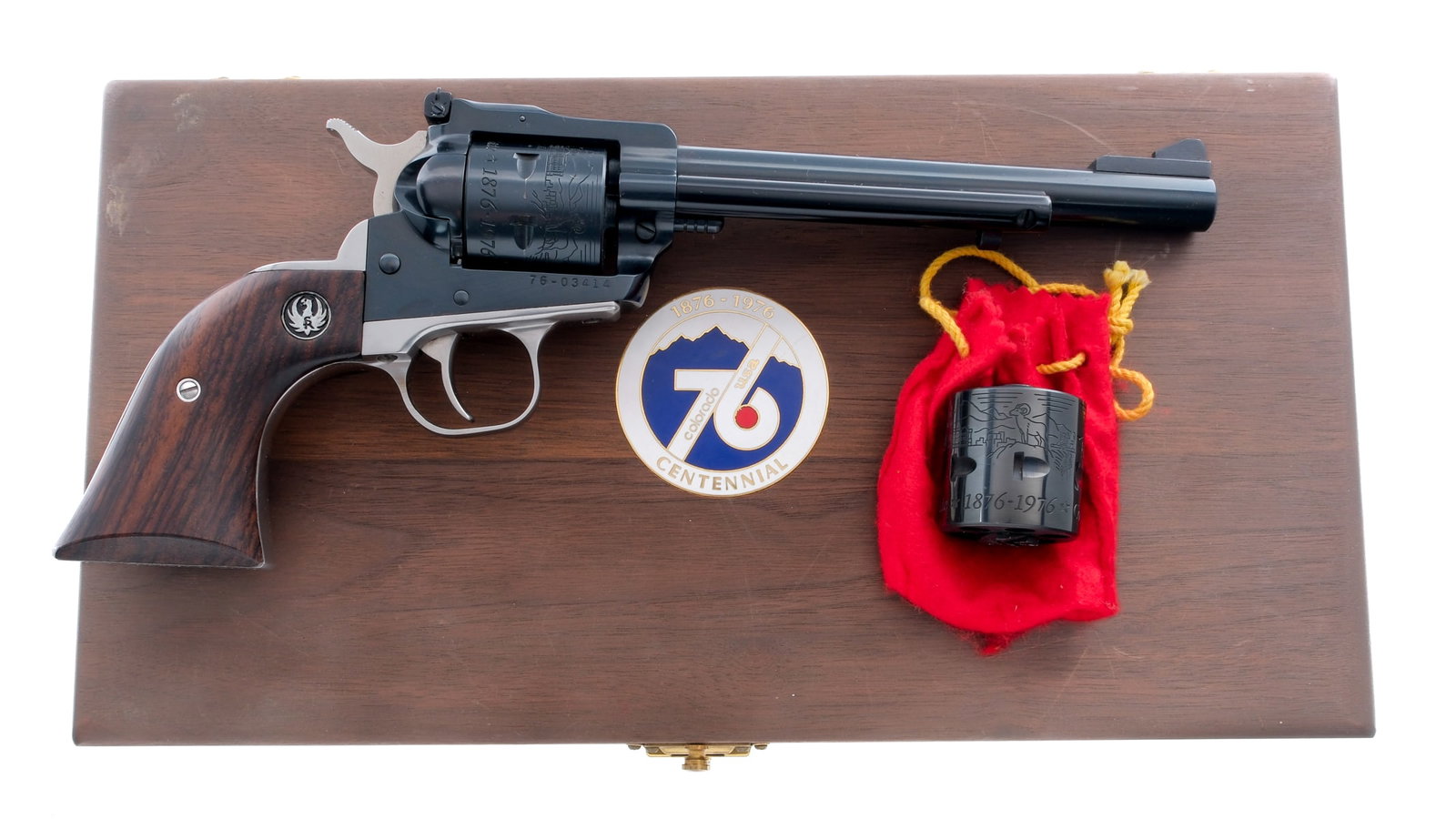 Ruger Colorado Centennial NM Single-Six Ruger: Description Ruger 1876 Colorado Centennial 1776 U.S. Bicentennial New Model Single-Six .22 caliber single action revolver. Blued finished barrel and frame. Stainless finished serrated hammer, smooth t