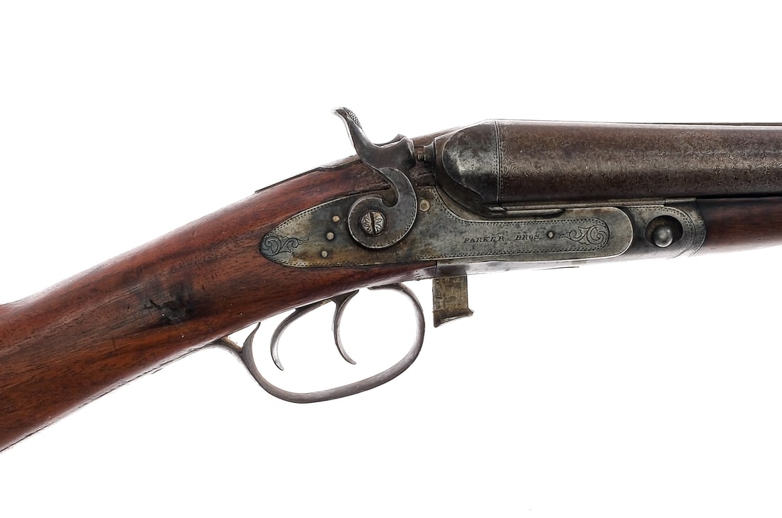 Parker Bros D Grade 12Ga SxS Hammer Shotgun: Description Parker Bros D-Grade (Lifter Action/Underlifter Shotgun) in 12 gauge with a two round capacity and a 32" side by side Damascus steel barrel. Made in Meriden Connecticut. Metal butt plate. S