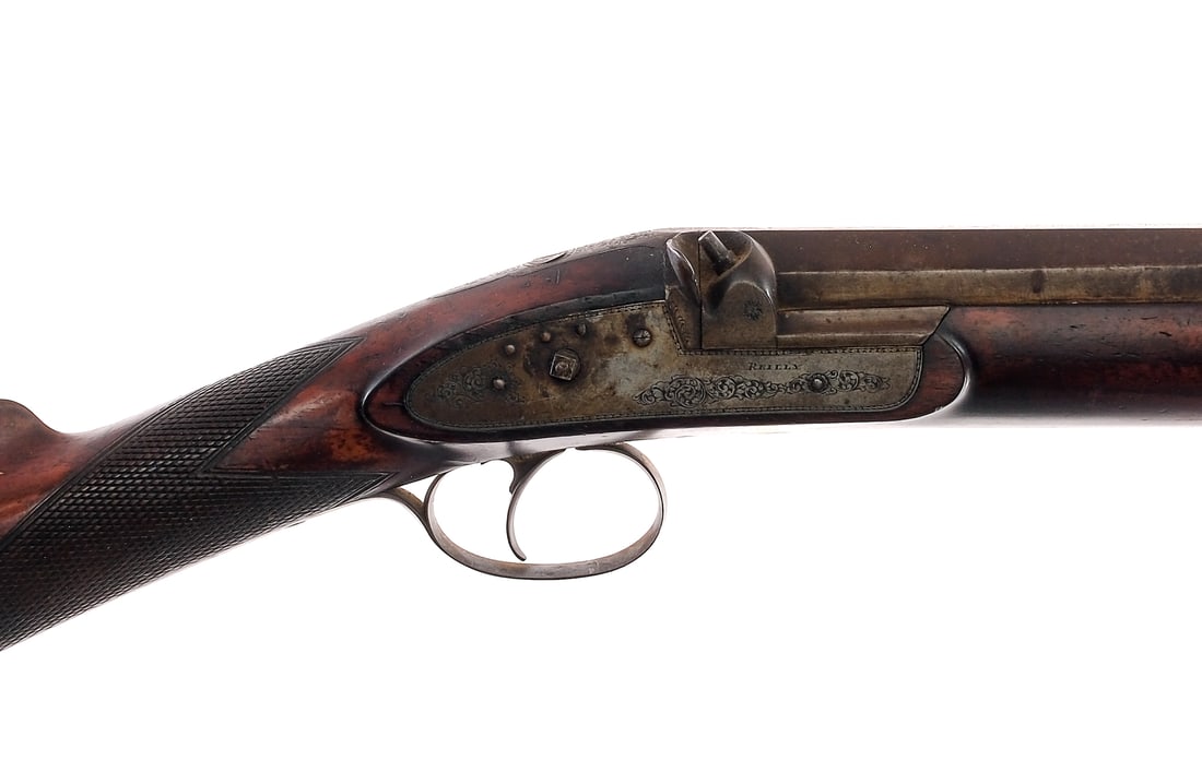 Joseph Charles Reilly Percussion Musket Rifle: Description Joseph Charles Reilly measuring in at the bore 19.30mm with a single round capacity and a 30" barrel. Engraved metal butt plate. Checkered wood half stock. Engraved finish worn trigger gua