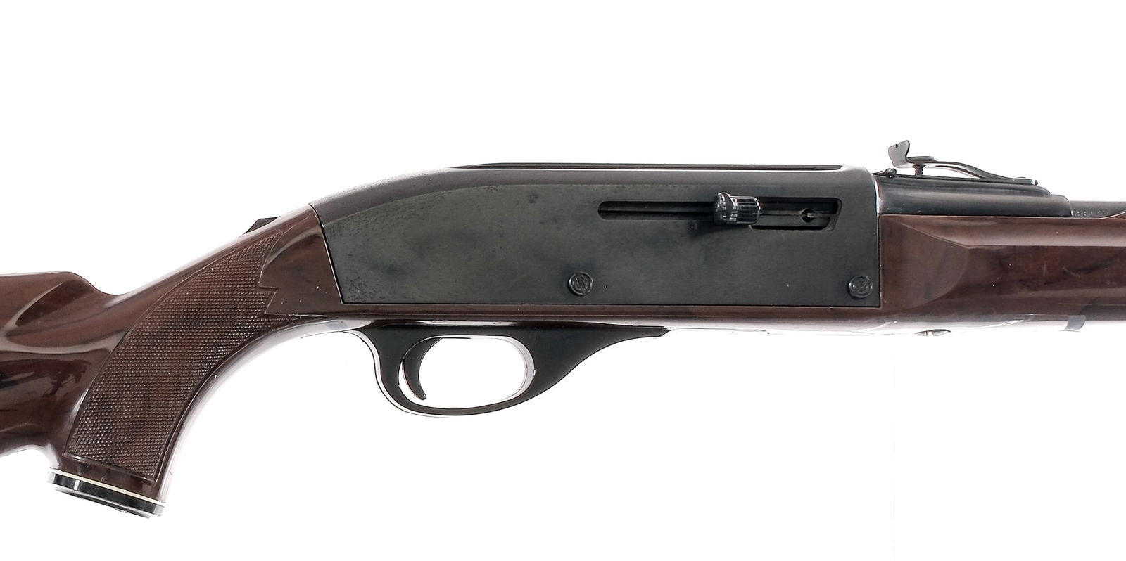 Remington Nylon 66 .22 LR Semi Auto Rifle: Description Remington Nylon 66 chambered in .22 long rifle with a fourteen round tube magazine and a 19.5" barrel. Blued barrel and frame. Serrated charging handle and trigger. Tang mounted safety. Ad