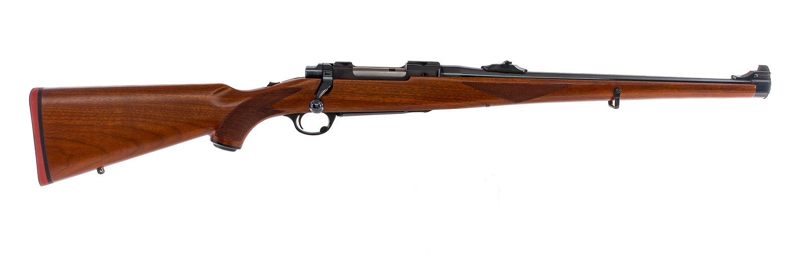 Ruger M77 Mannlicher .243 Win Bolt Rifle: Description Ruger M77 chambered in .243 Winchester with a four round hinged integral magazine and a 18.5" barrel. Glossy blued barrel, receiver, bolt handle, and bolt release. Serrated tang safety. Al